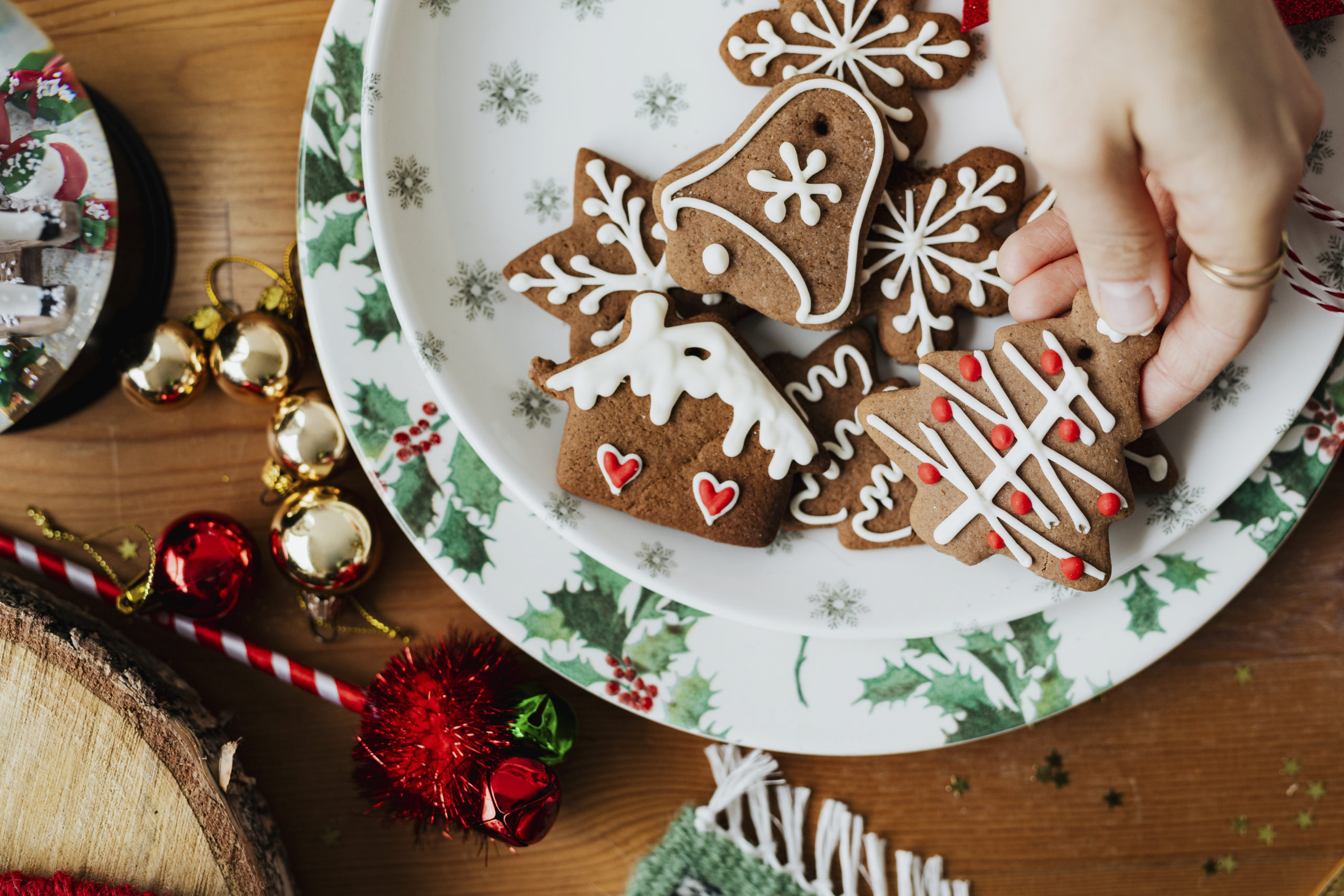 Woman grabbing a Christmas cookie